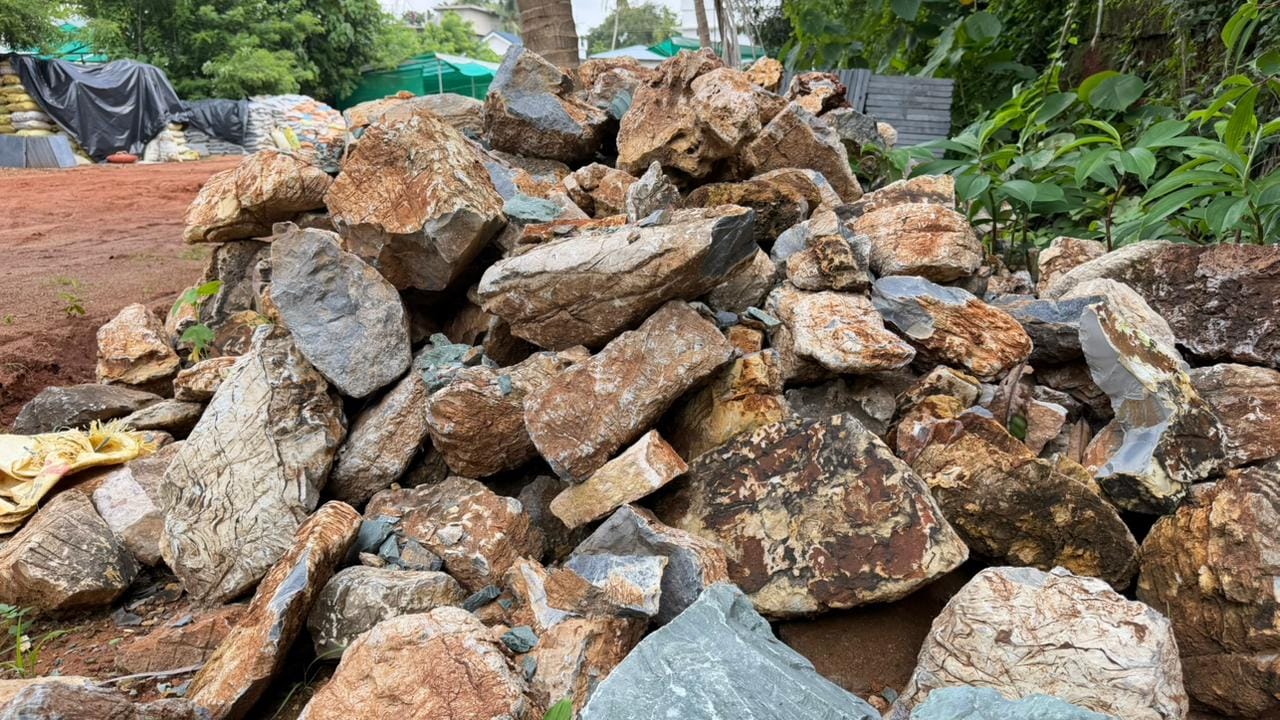 mixed color natural waterfall setting rocks.